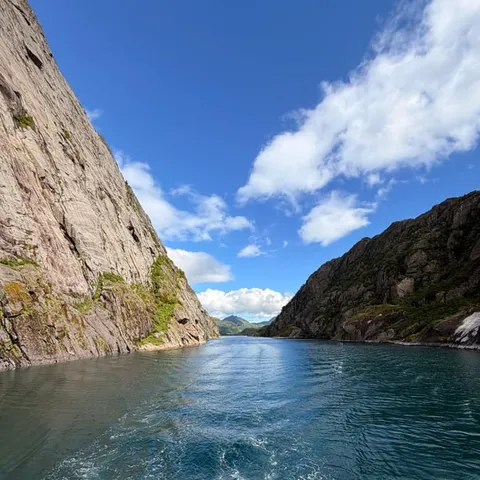 The steep walls of the Trollfjord seen from the water